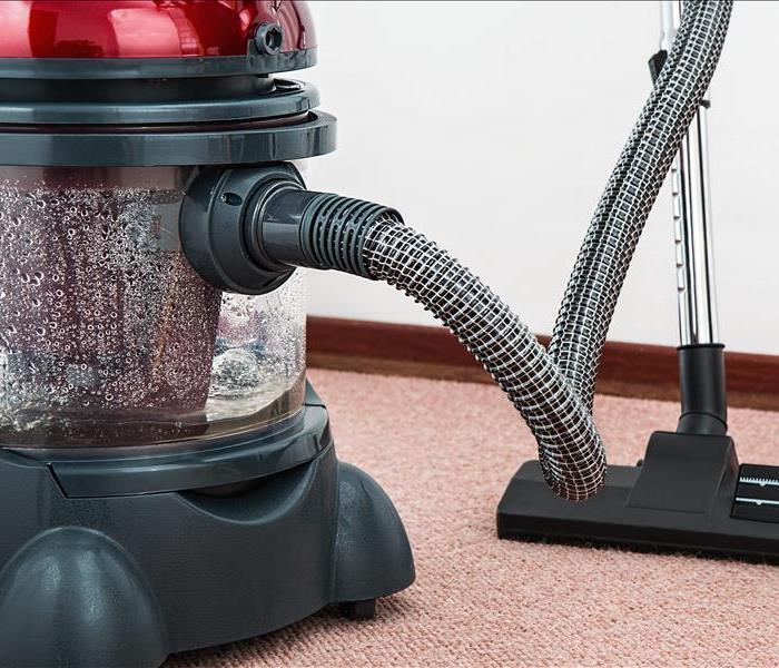 Water on floor with vacuum